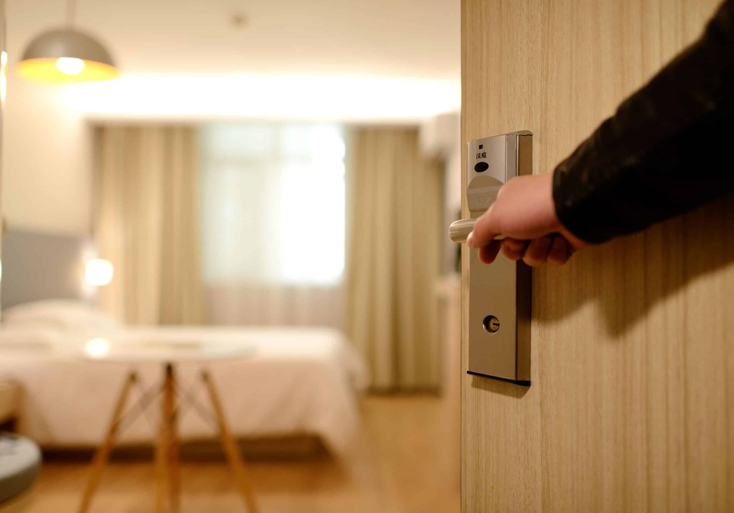 Opening the door to a hotel room